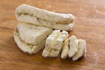 Homemade dairy, soft cheese, milk product on wood