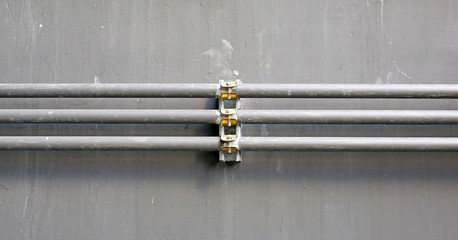 aluminium wire pipe at cement wall