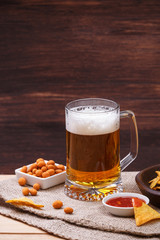 Glass of beer. Nachos chips. Tortilla snack.