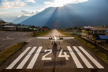 Airplane before taking off at Runway of small Airport Himalaya - Powered by Adobe
