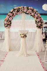 flowers on a wedding arch in frieze tones, background