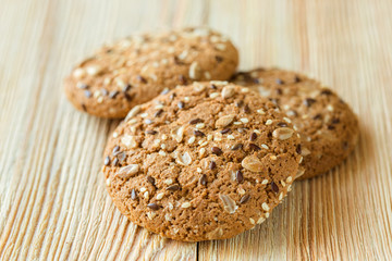 Few oatmeal cookies on a wooden table