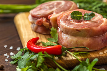 raw breast wrapped in a roll