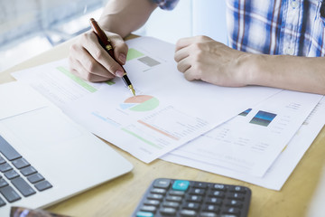 Asian Business man discussion and analysis data at meeting