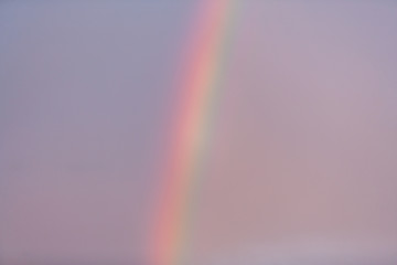 Rainbow in the blue sky.