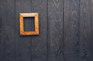 photo frame on old wooden wall