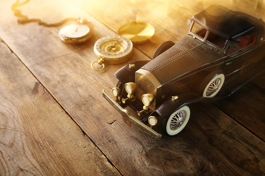 Vintage toy car over wooden table
