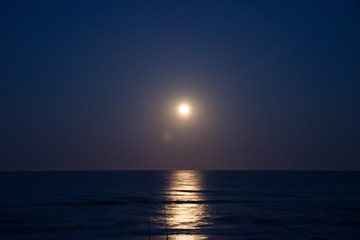 Fototapeta premium Sunset and the moon rising on the Mediterranean coast in southern Spain