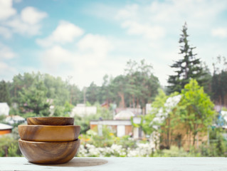 stack of empty wooden bowls on table