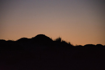 Sunset and the moon rising on the Mediterranean coast in southern Spain