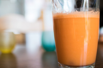 Orange and carrot centrifugal juice. Fresh juice of orange and carrot with ginger. healthy and vegan drink