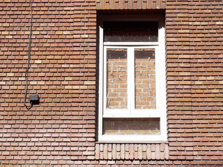 Window covered with brick