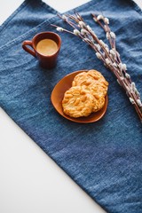 A cup of espresso on a table with cookies