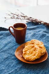 A cup of espresso on a table with cookies