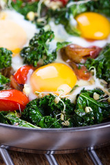Fried eggs with vegetables.
