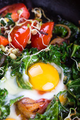 Fried eggs with vegetables.