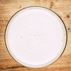 Glass of beer on wooden table. wallpaper with copy space