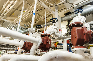 Industrial, steel pipe lines valves in ship’s engine room