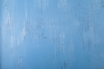 Blue wood background. Painted scraped wooden board. Grunge plywood texture or pattern.