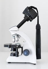 DSLR Camera attached with adapter to microscope.