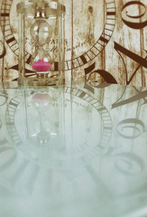 Hourglass on wooden clock