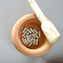 Herbal capsule with healthy medical plant. Alternative drug.