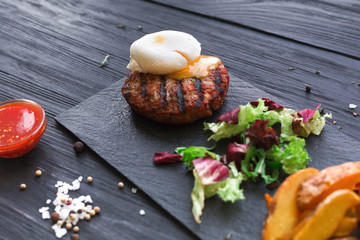 Grilled beef steak on dark wooden table background