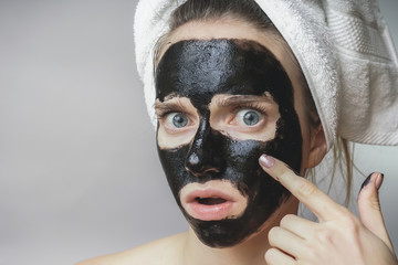 Black mask on woman face,smiling,skincare,cleansing pore,against acne