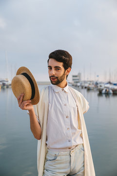 Young man posing with the hat