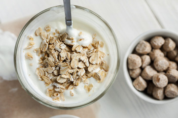 Oat flakes in glass with smoothie top view