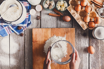 Making dough top view on rustic wood background