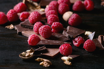 Dark and milk chopping chocolate and chips shavings chopping chocolate with fresh raspberries heap...