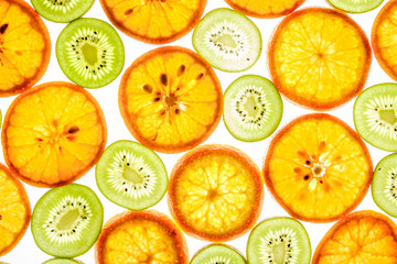 Mandarin and kiwi slices on white