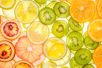 Beautiful fresh sliced mixed citrus fruits as background