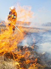 Firefighter fights grass fires. Polish firefighter. © Dagmara_K