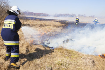 Firefighter fights grass fires. Polish firefighter. © Dagmara_K
