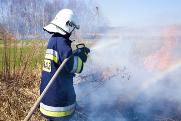 Firefighter fights grass fires. Polish firefighter. © Dagmara_K
