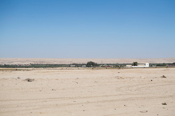 Fototapeta na wymiar Desert Landscape with Small Settlement near Swakopmund, Namibia