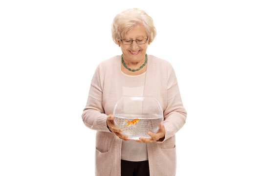 Mature Woman Holding A Bowl With A Goldfish