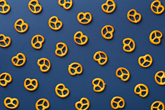 Flat lay pretzels pattern on blue background
