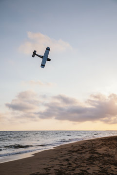 Fototapeta A flying toy plane