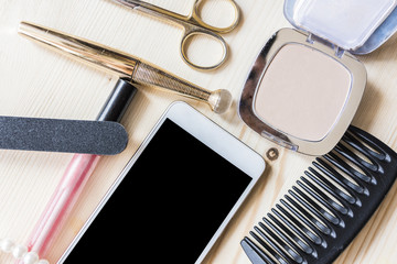 woman mascara. comb and phone 2