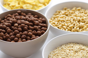 Bowls of breakfast cereals on a white background
