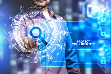 Business, Technology, Internet and network concept. Young businessman working on a virtual screen of the future and sees the inscription: Protect your identity