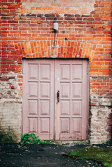 The door on the red brick wall