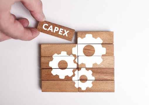 Business, Technology, Internet and network concept. Young businessman shows the word: Capex