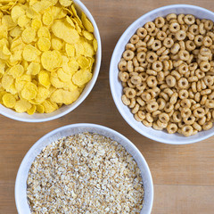 Bowls of cereal on a wooden table top view