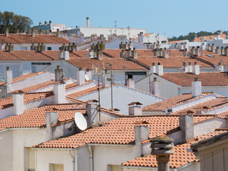 Red roofs, white building, small town