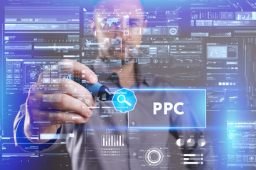 Business, Technology, Internet and network concept. Young businessman working on a virtual screen of the future and sees the inscription: PPC