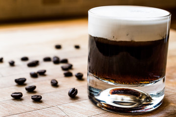 White Russian Cocktail with coffee beans.
